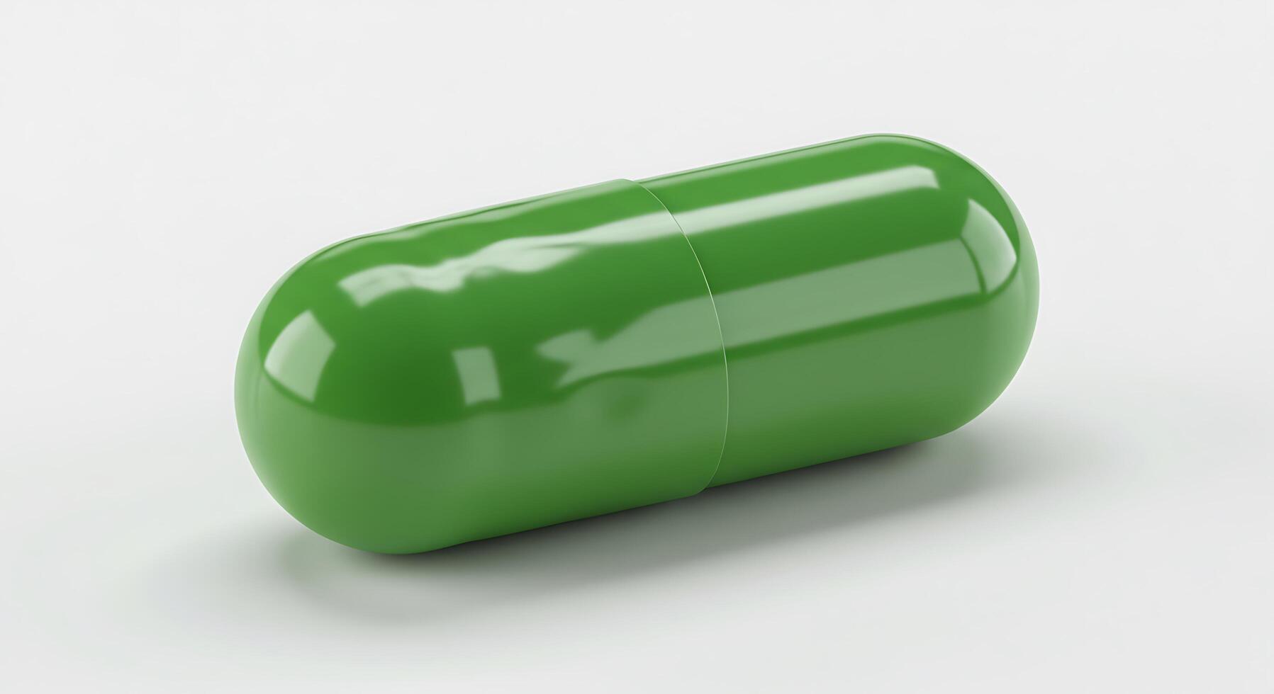 A green pill on a white surface photo