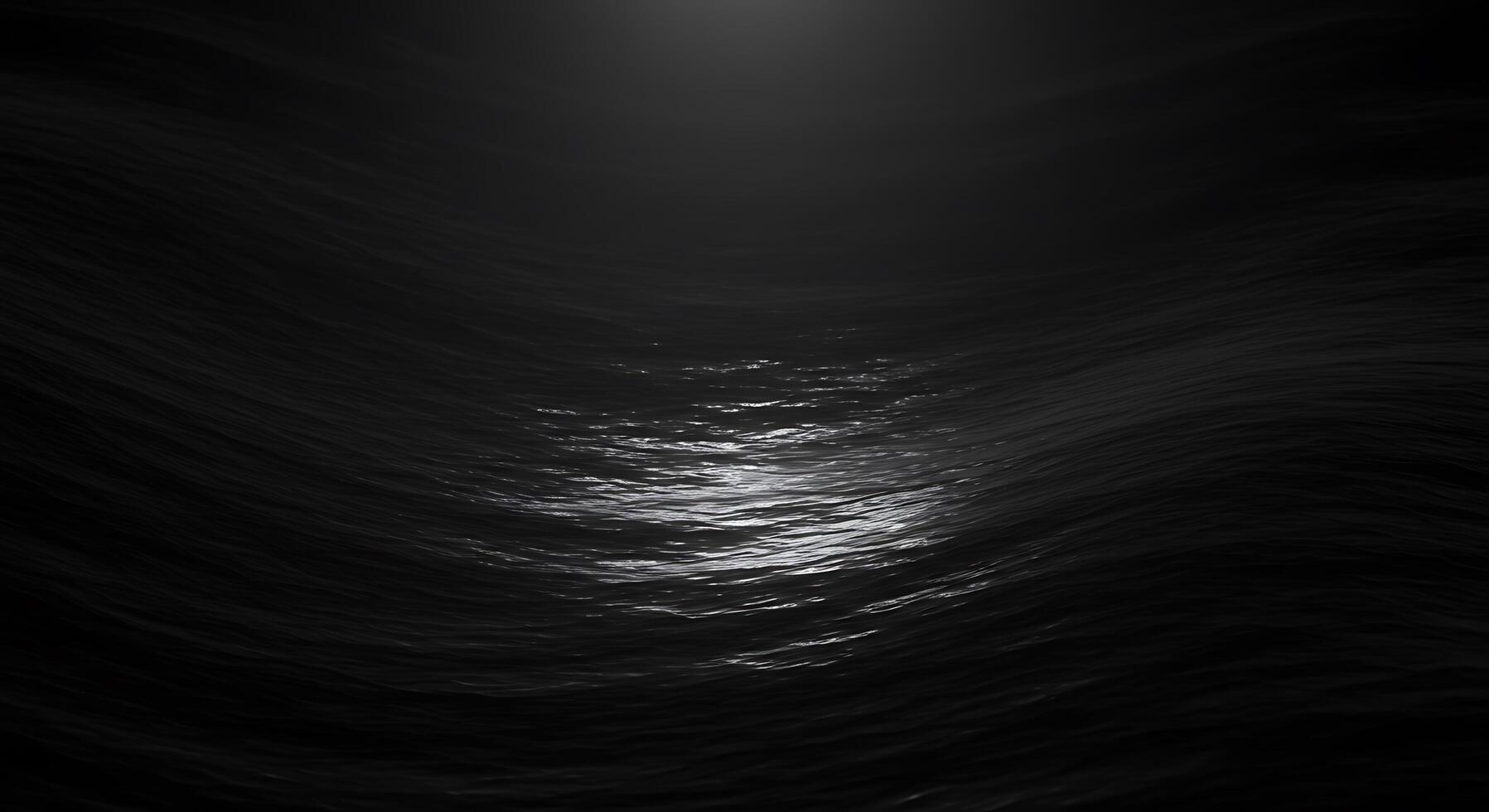 A dark ocean with waves and a bright light photo
