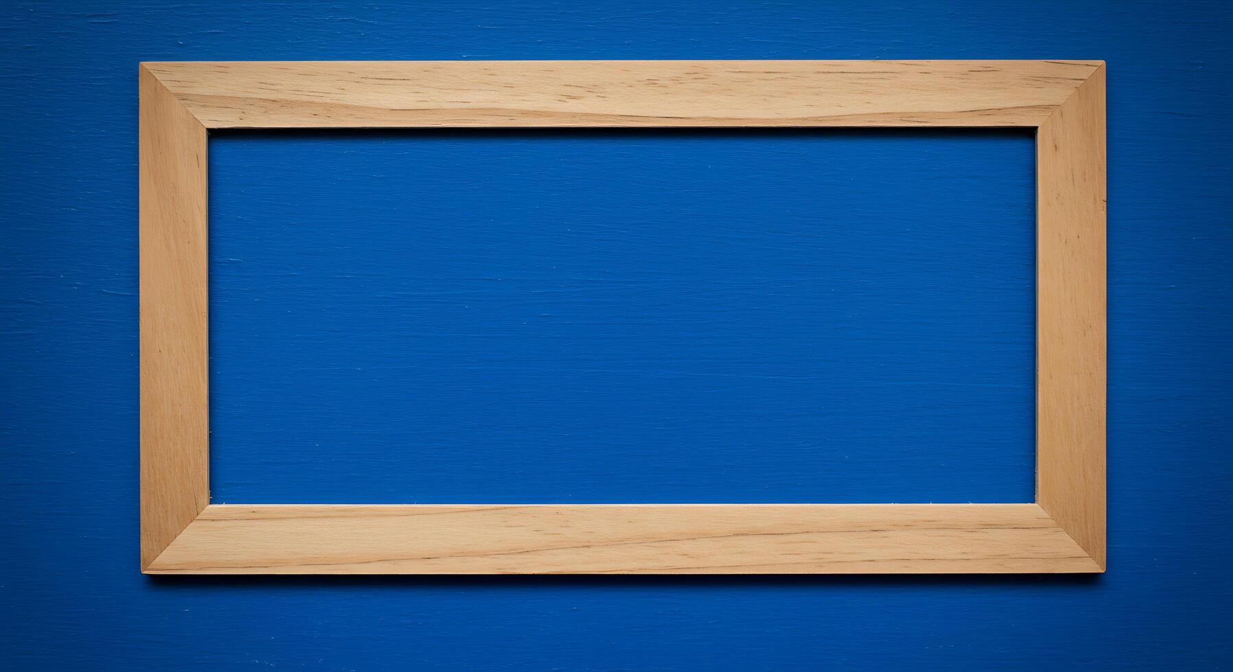 Wooden frame on blue wall photo
