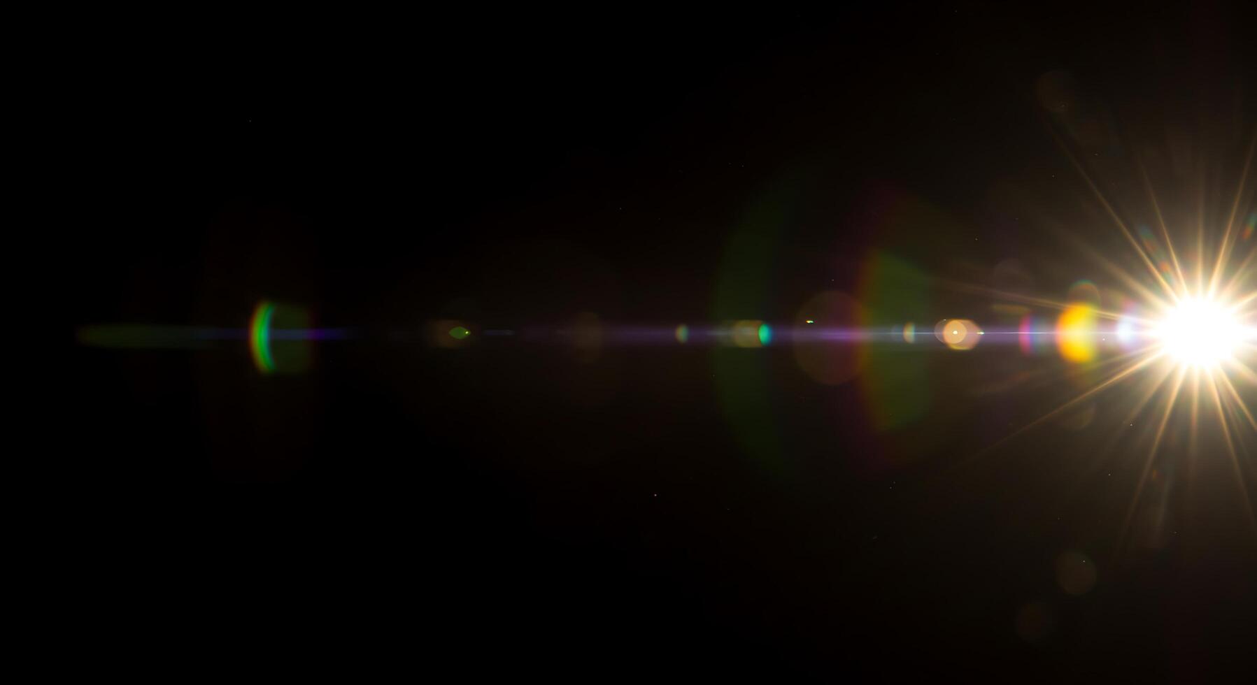 A bright light shining through a dark background photo