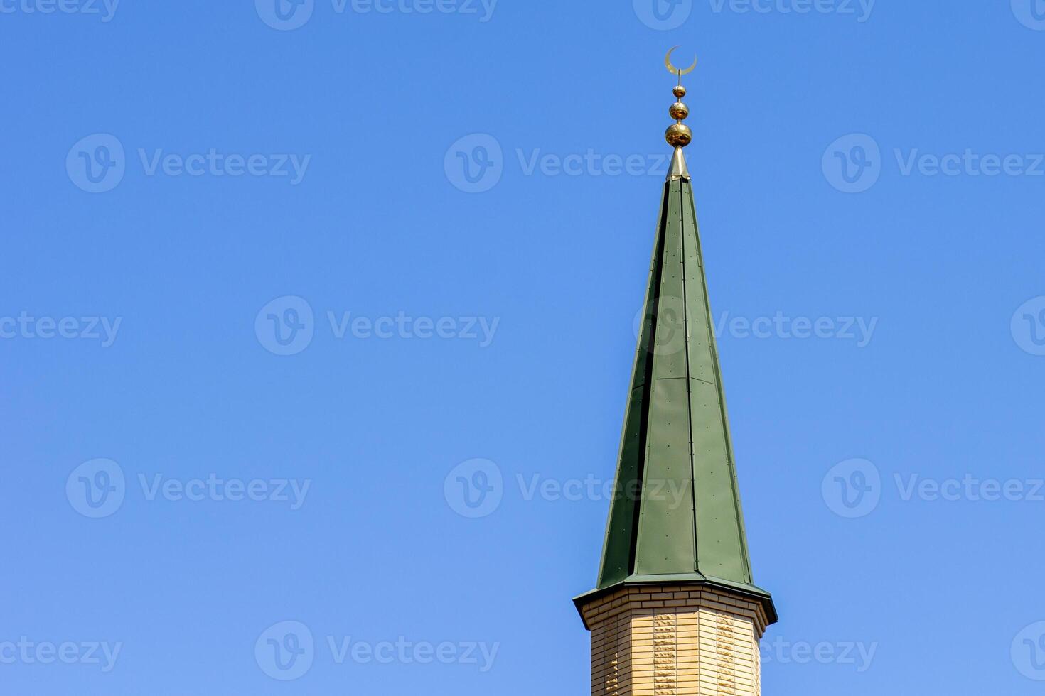 Minaret of a mosque against clear blue sky in Simeiz, Crimea photo