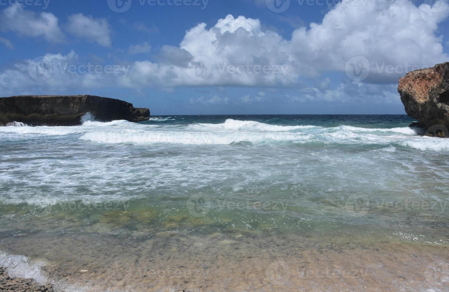 Coastal Tides with Waves Rolling Under Cloudy Skies photo