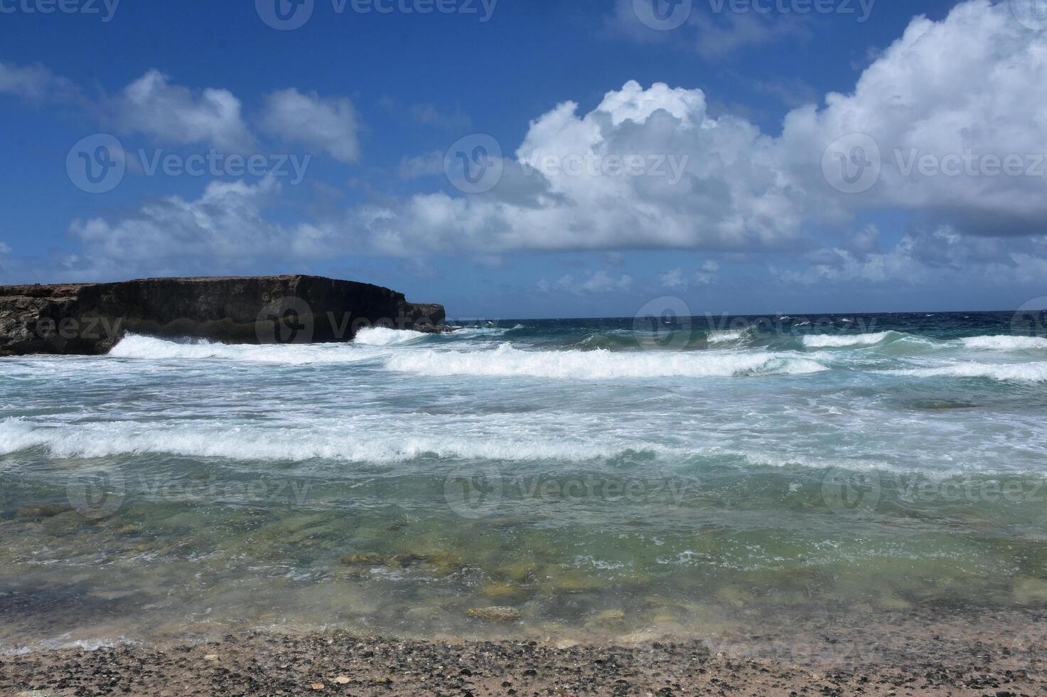 Waves Crashing and Rolling Ashore in Aruba photo