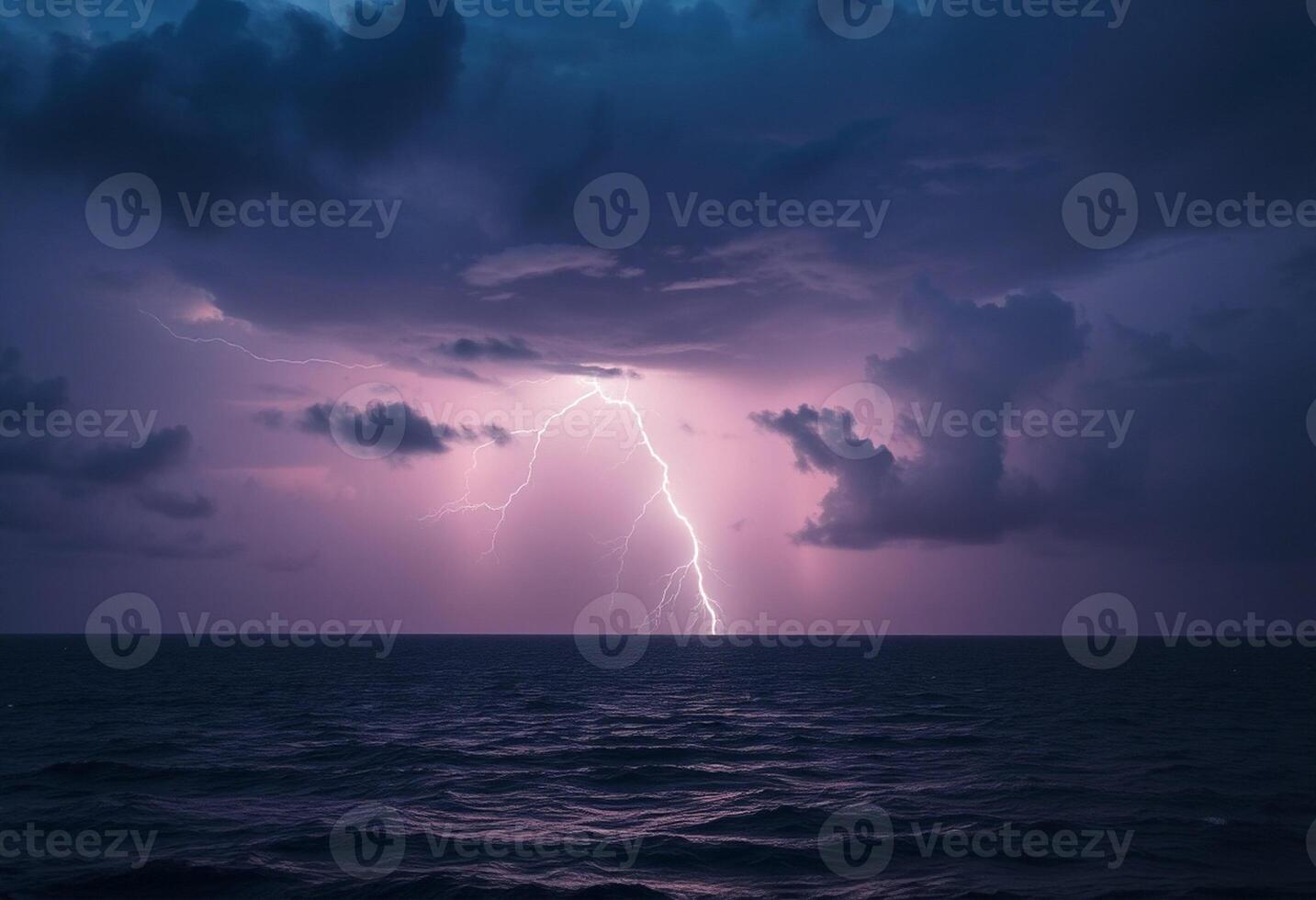 Lightning over the ocean with dark clouds and a storm photo