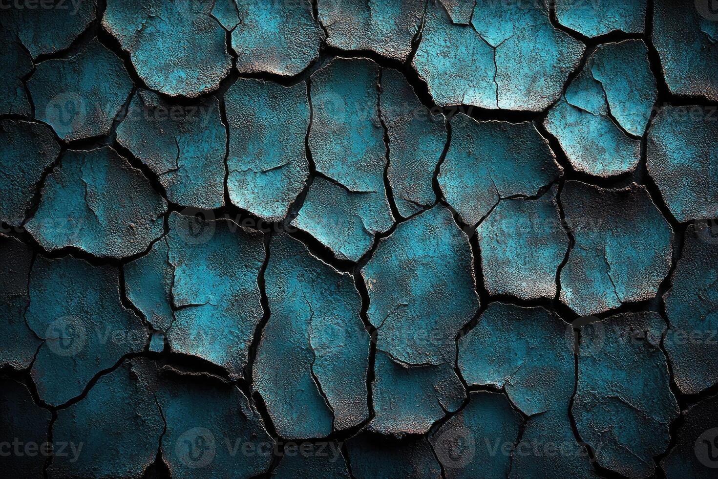 Deeply cracked, dark teal surface texture. photo