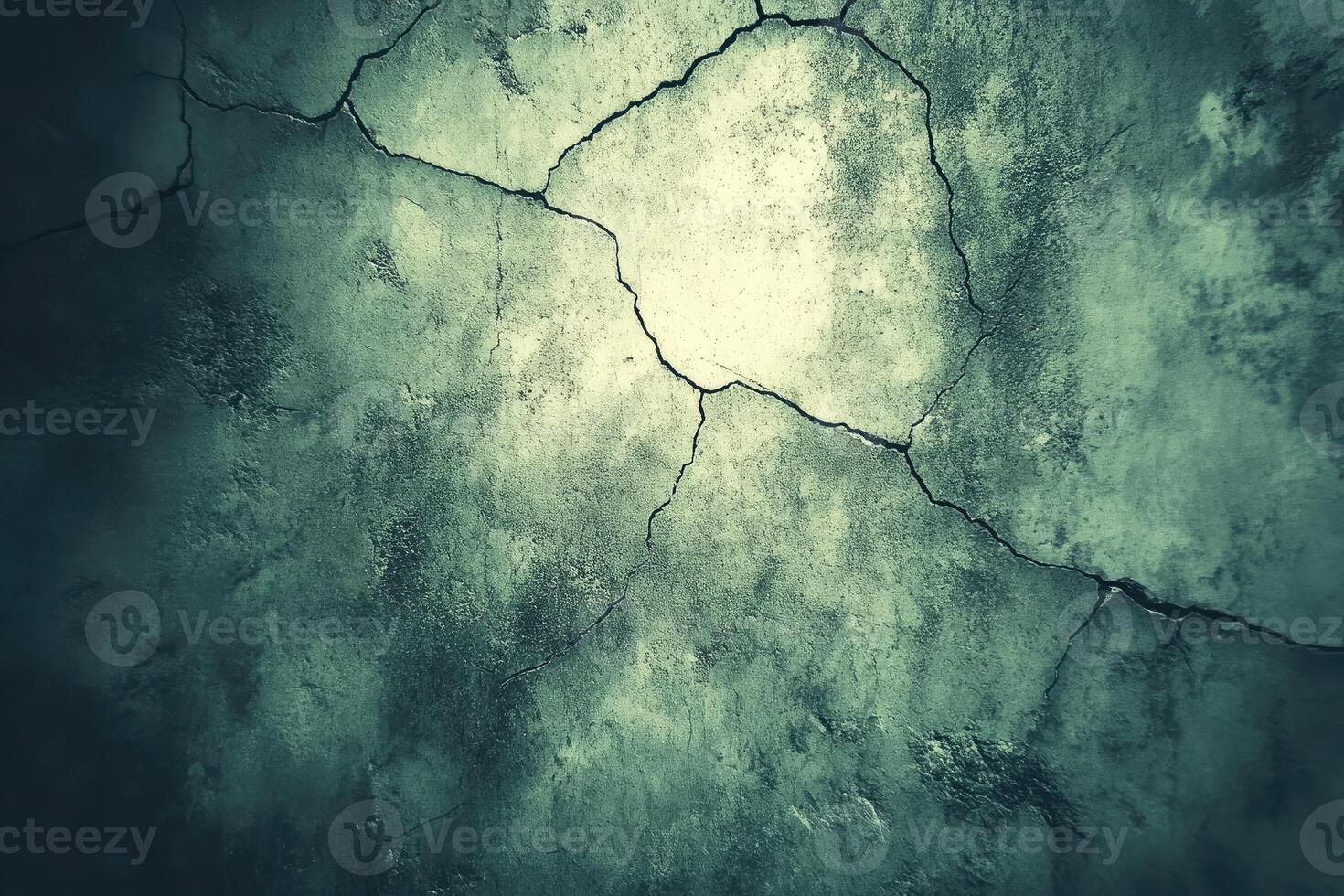 Cracked concrete surface with muted tones. photo