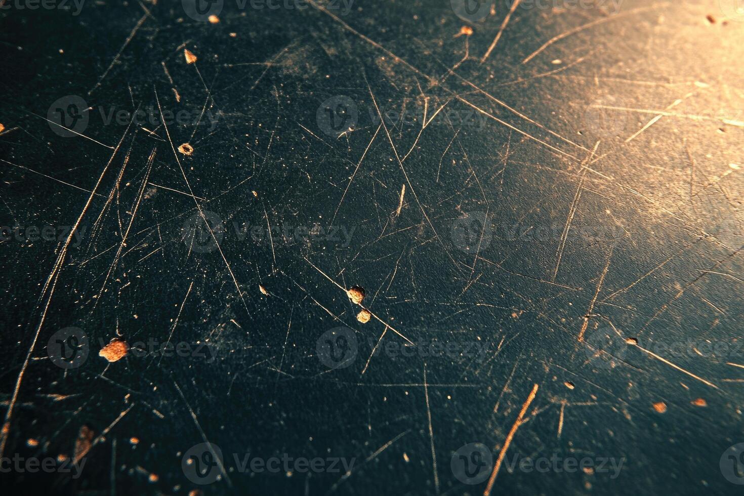Close-up view of a dark surface with scratches and marks. photo