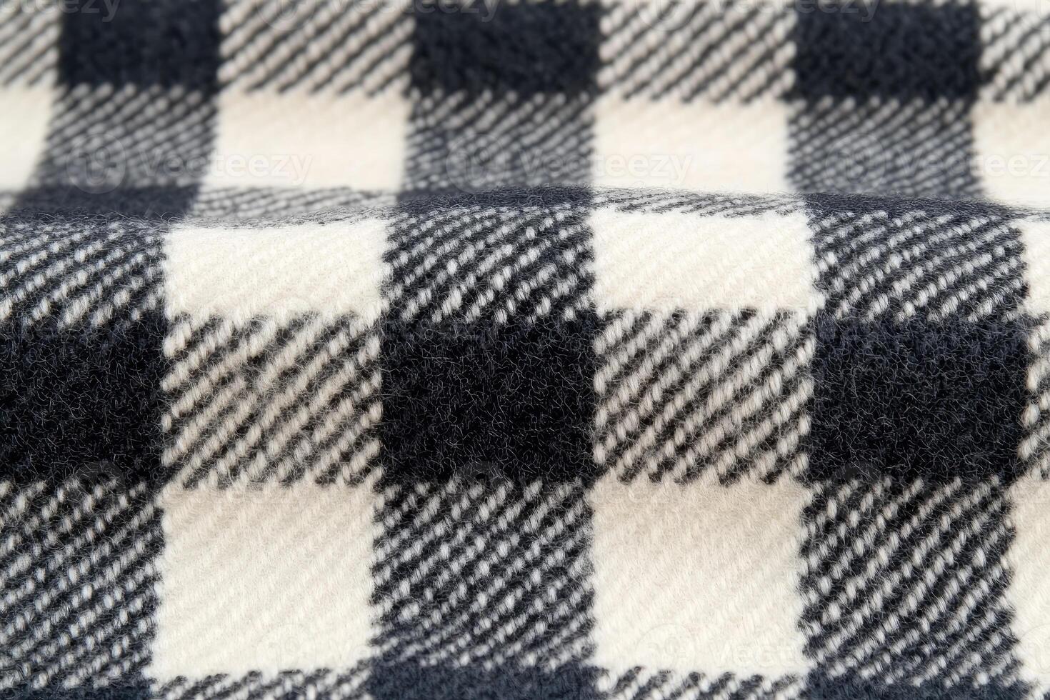 Close-up view of a black and white checkered fabric. photo