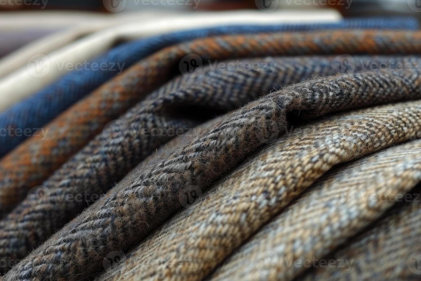 Close-up view of various textured fabrics displayed in folds. photo