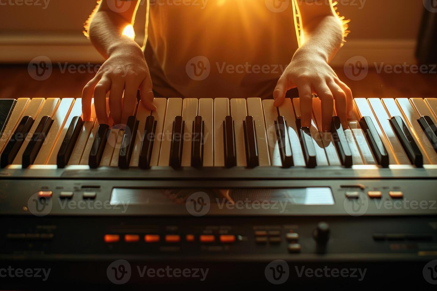 Close-up of hands playing a digital keyboard at dusk. photo