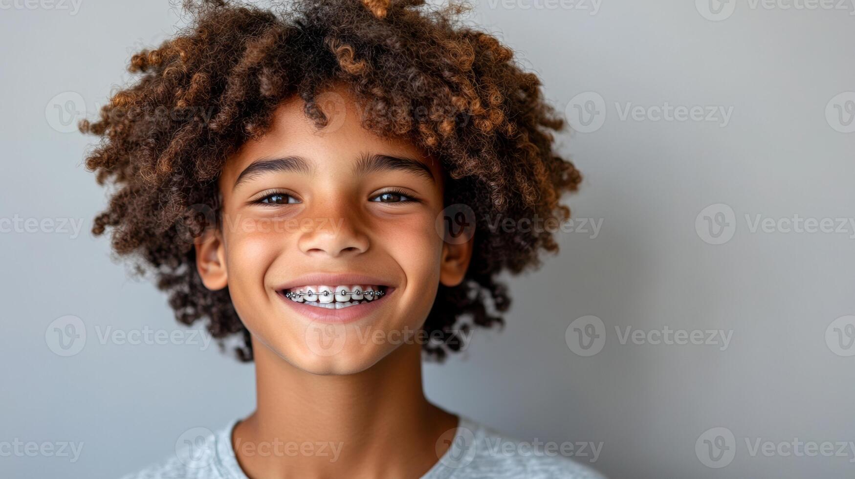A young boy with braces smiling photo