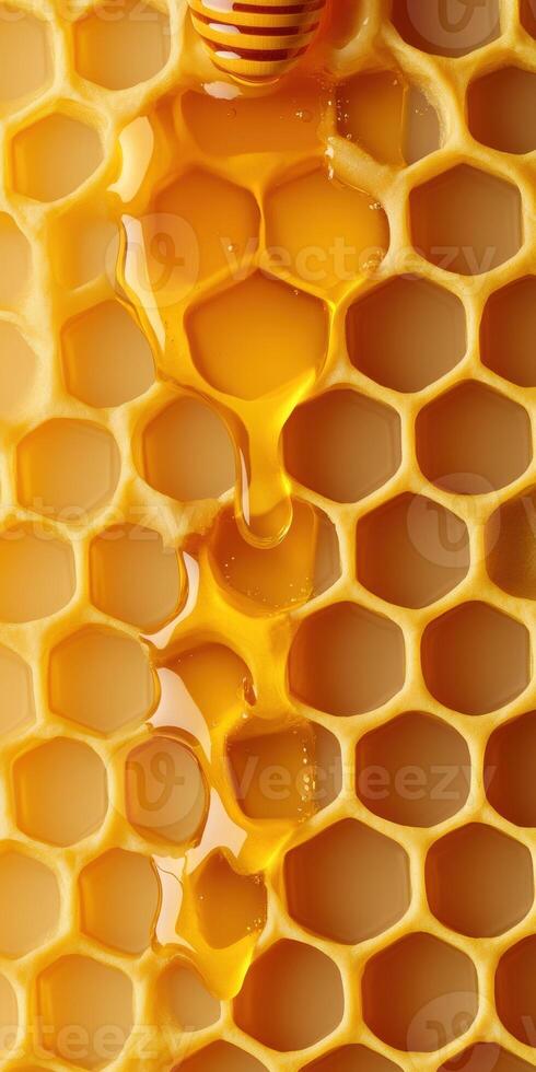Golden honeycomb with dripping honey pattern for design and decoration photo