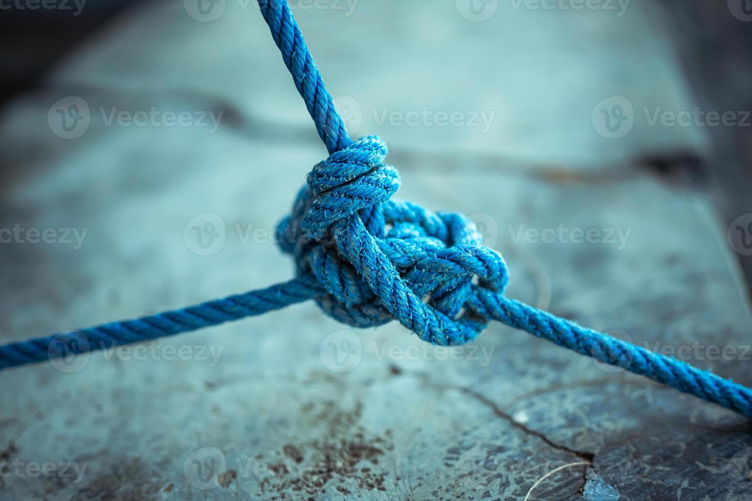 A Photo showcasing a strong blue rope under tension, with visible fiber detail