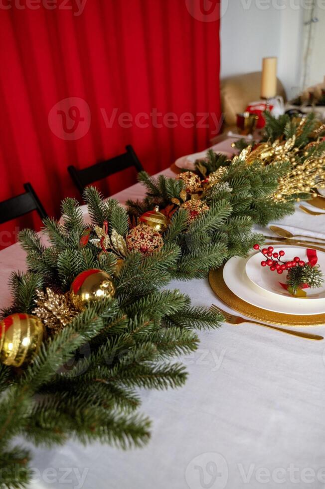 A table set for christmas with gold and red decorations photo