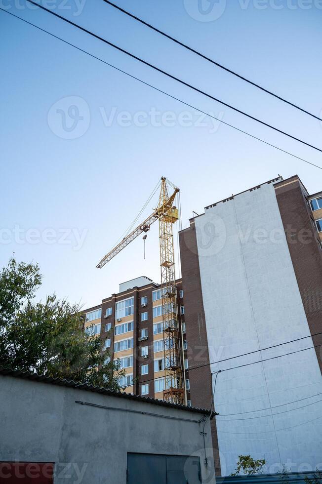 A building with a crane on top of it photo