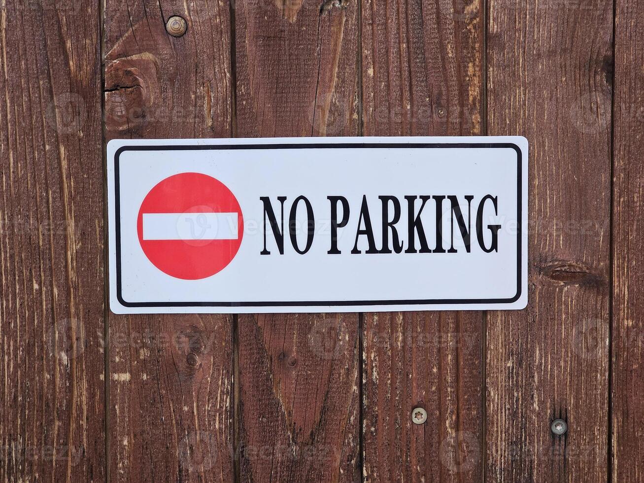 No parking sign on wooden background. photo