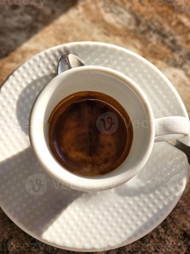 A cup of coffee isolated on the background, top view. photo
