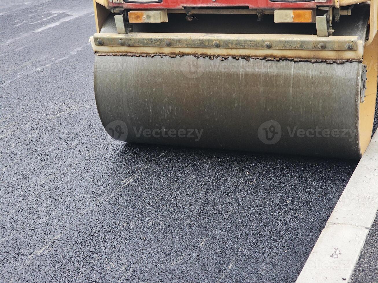 Roadworks, Road construction. Paving roller on roadworks at construction site, paving works. photo