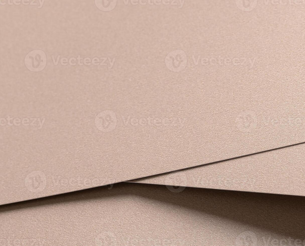Paper texture with warm beige and soft champagne tones, glossy surface with subtle shimmer, elegant photo
