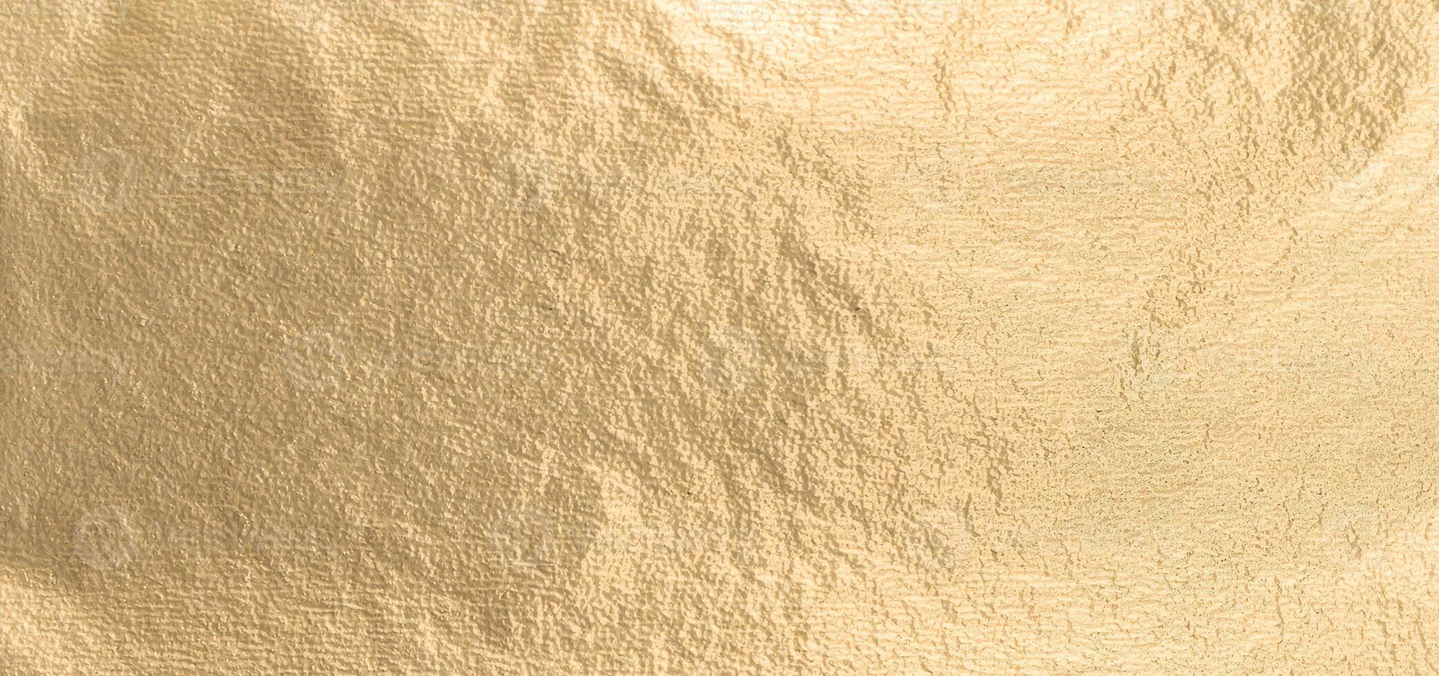 Gold metallic foil background with a smooth, shiny surface. Elegant, refined design in warm yellow photo