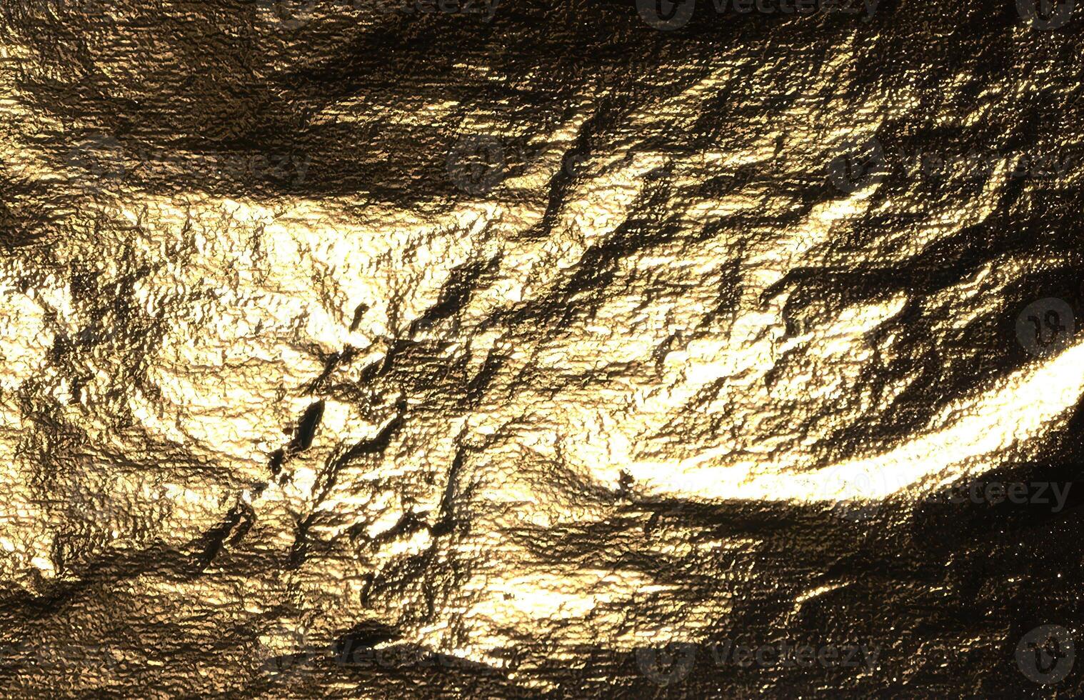 Gold foil with shiny, metallic texture creates a reflective, luxurious surface. Crinkled and creased photo