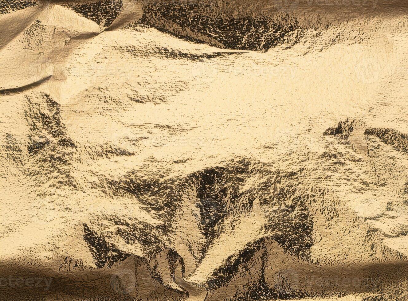 Lustrous golden foil with intricate folds and a slightly distressed surface, creating dynamic photo