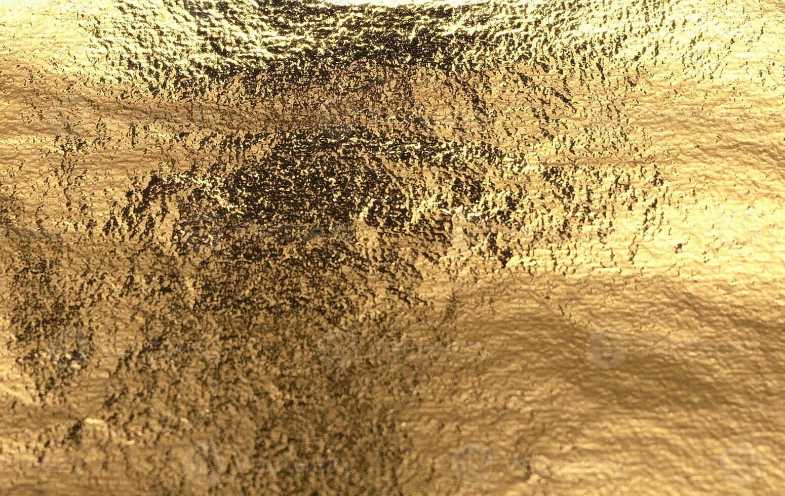 Gold foil texture with a shiny, reflective surface. Dark, crumpled patch and abstract wrinkles photo