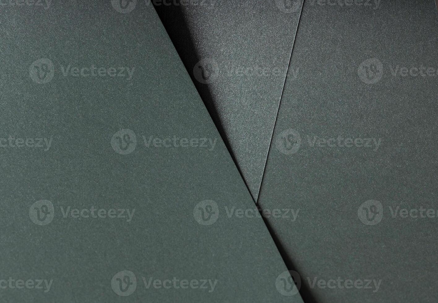 Paper texture with metallic green tone, elegant geometric overlay and glossy surface, layered photo
