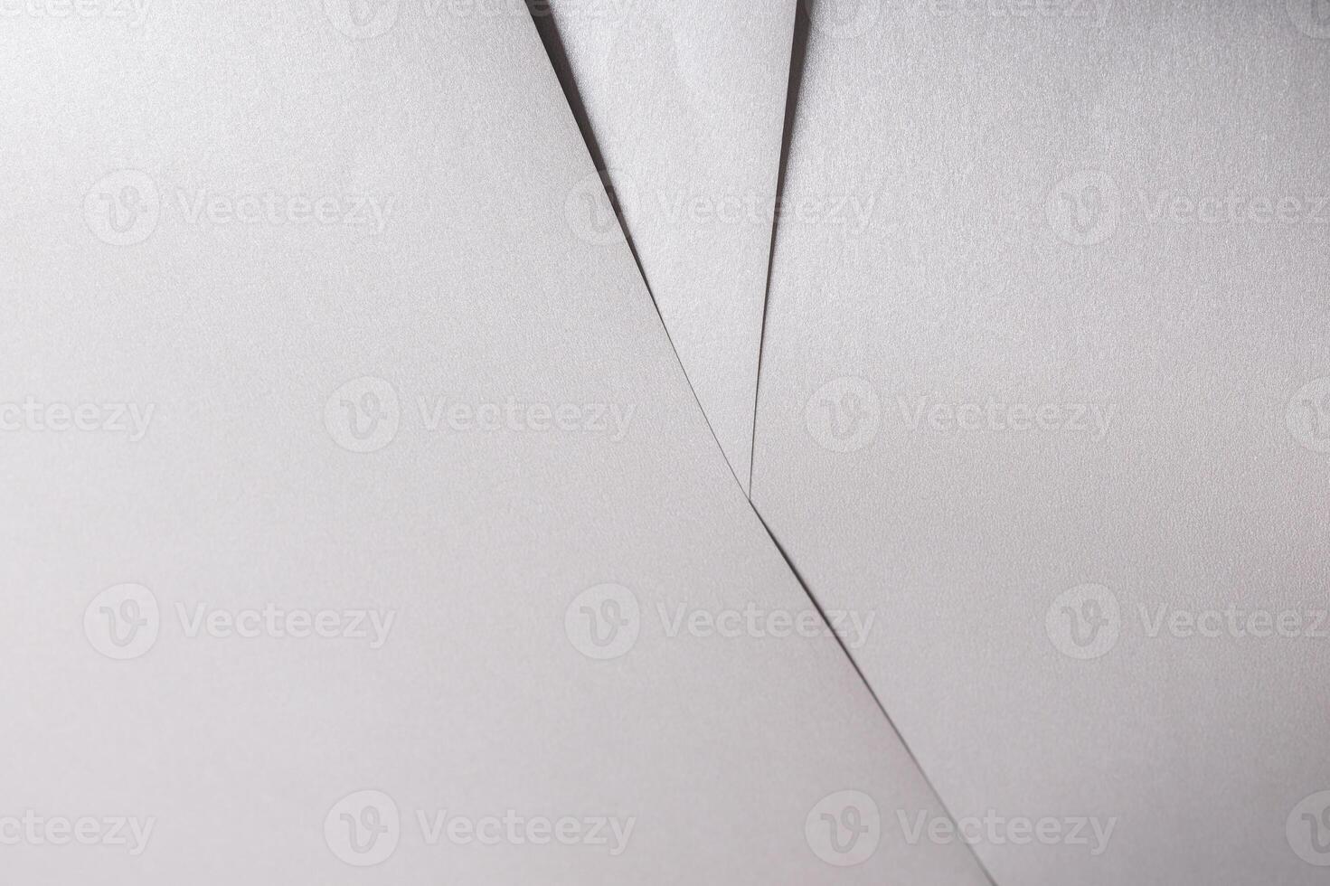 White paper texture with metallic silver and platinum tones, glossy finish and smooth folded surface photo