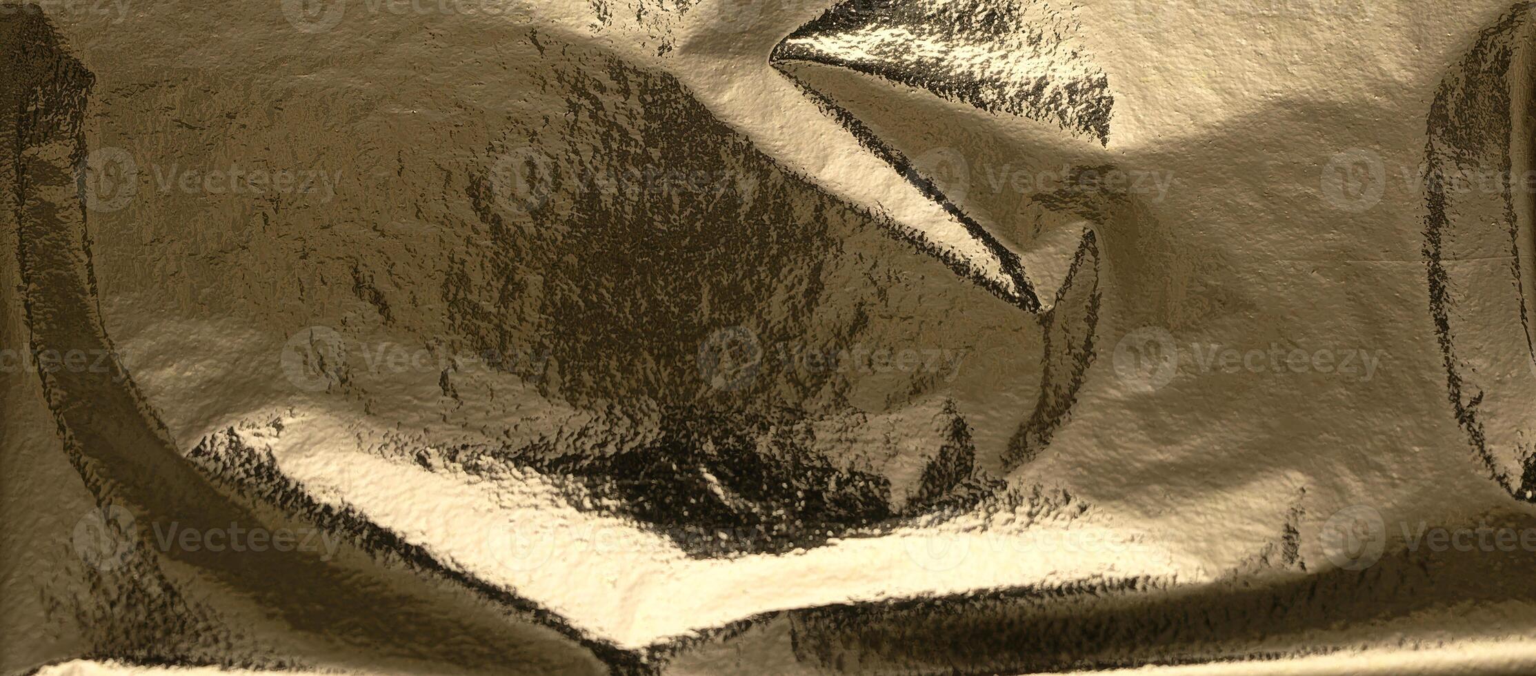 Gold and golden foil texture with a shiny, wrinkled, and creased surface. Rich, reflective material photo