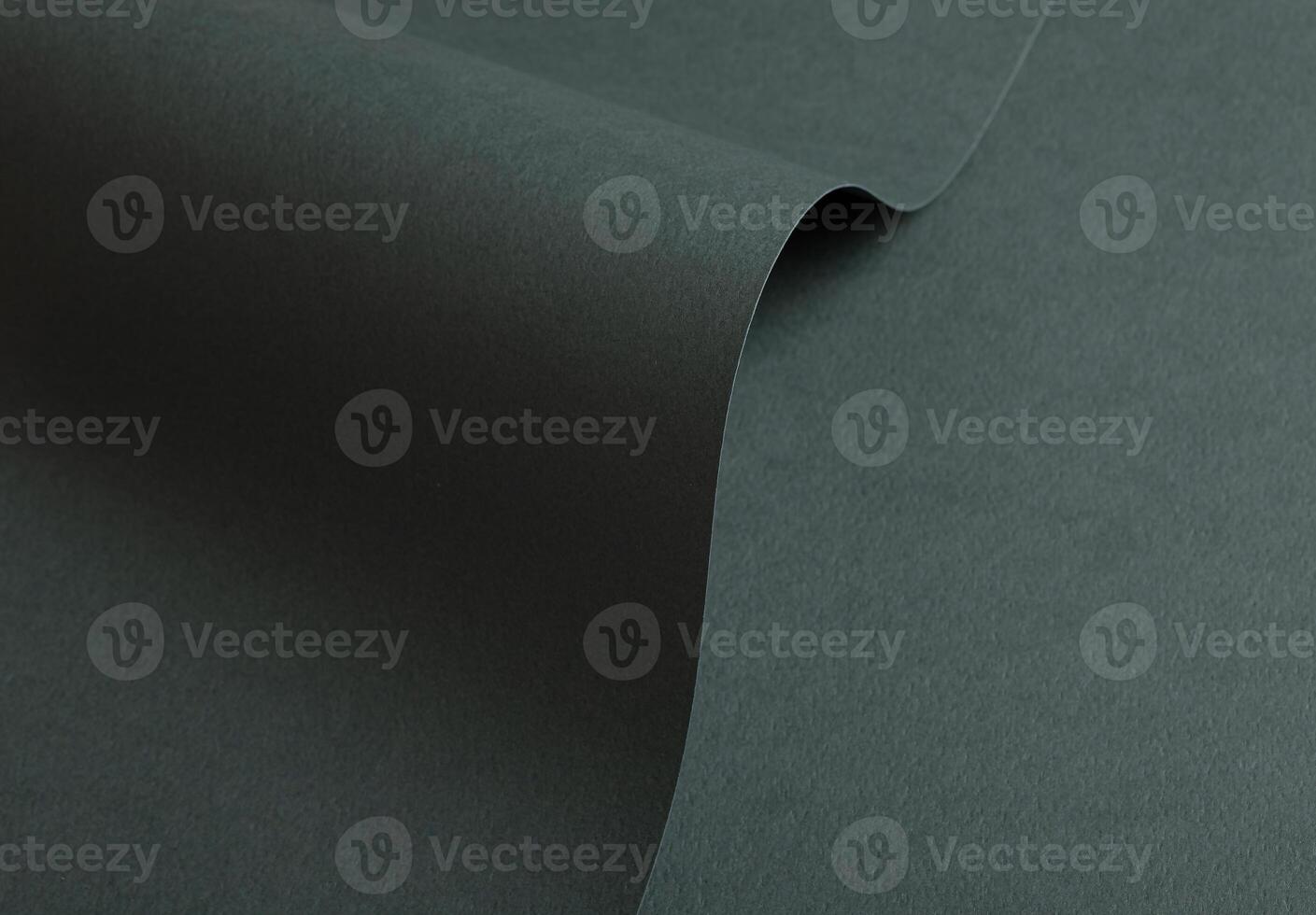 Paper texture with deep green tone, clean surface and folded wave finish, elegant forest green photo