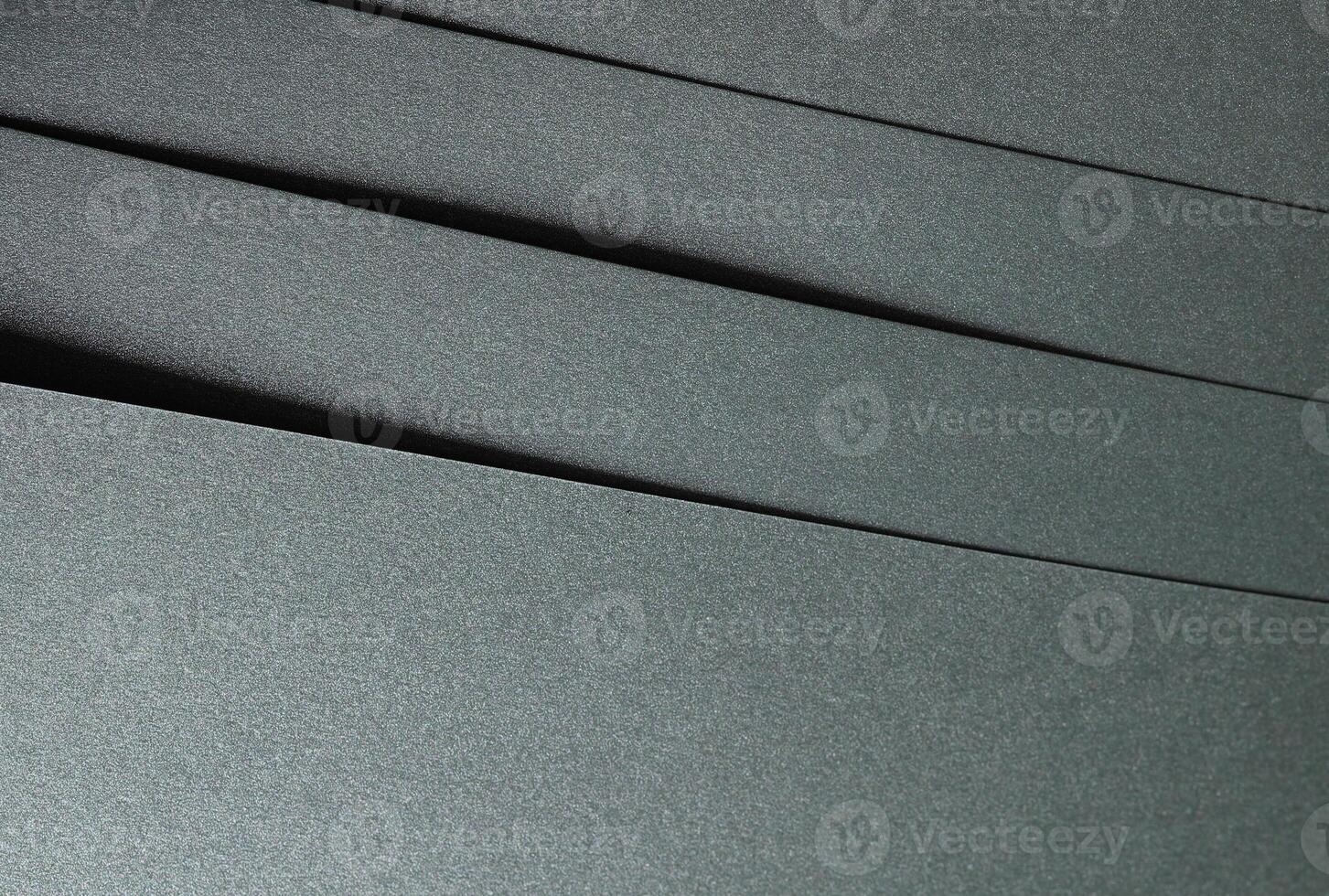 Paper texture with glossy finish, chic layered designer paper in dark green, forest green, and olive photo