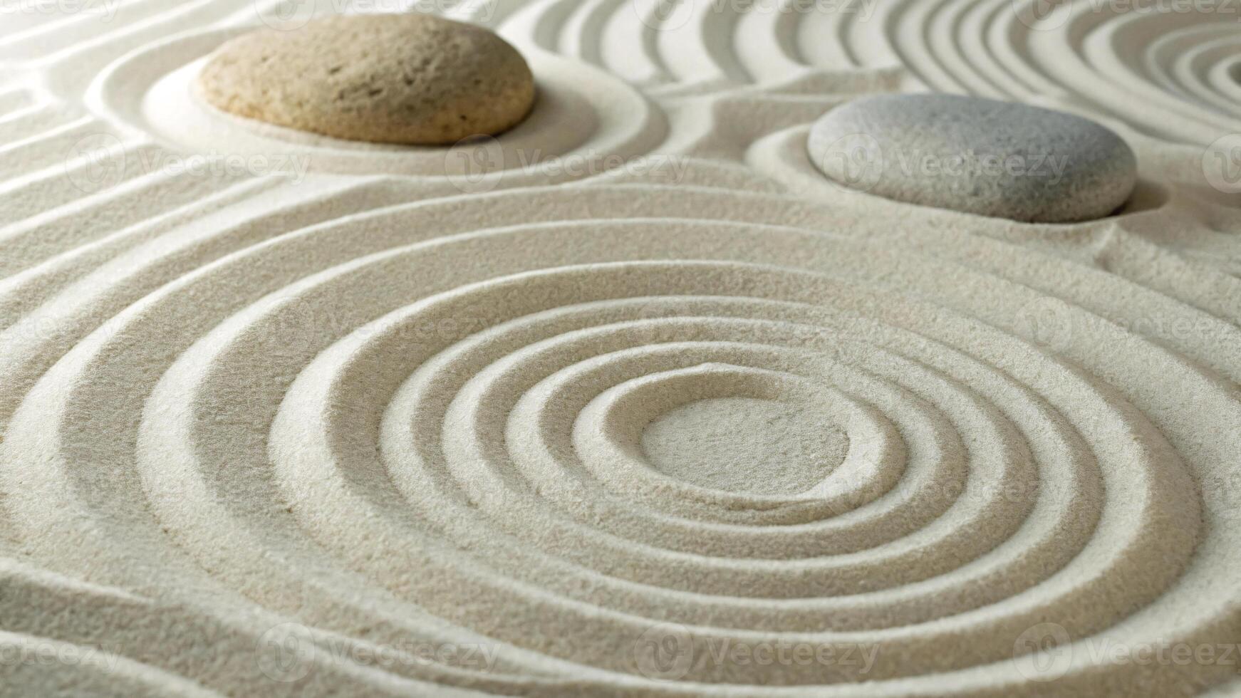 Zen Garden with Spiral Sand Patterns and Smooth Stones on it. photo