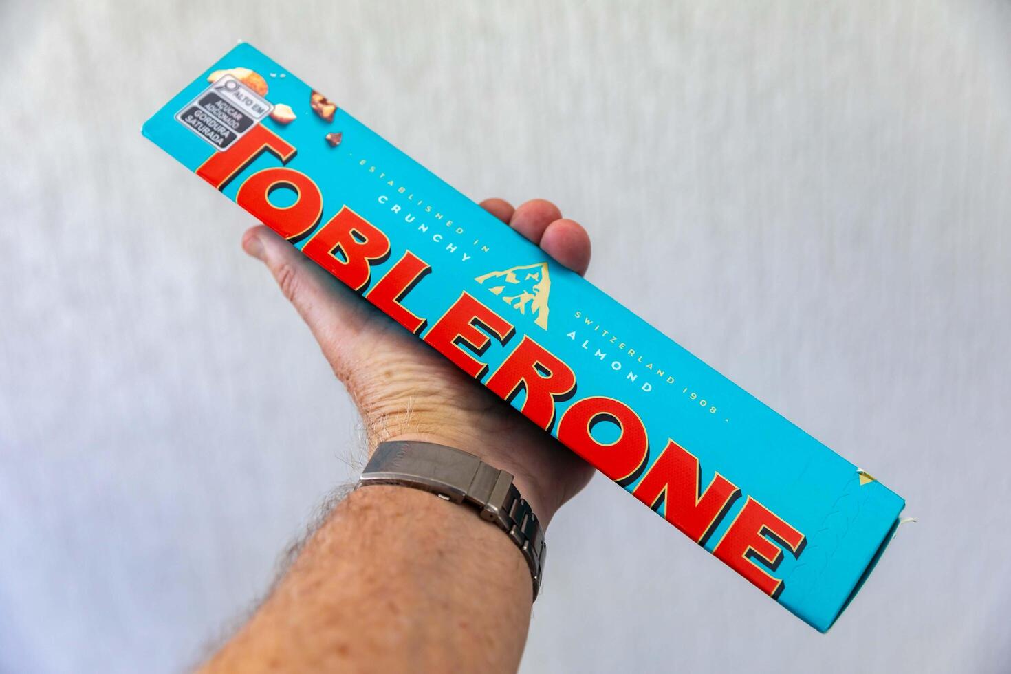 Brazil, May 10, 2025. Toblerone chocolate with salt and almonds and chestnuts closeup photo