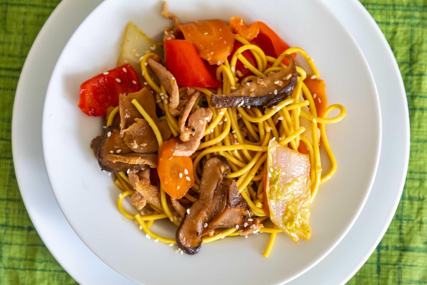 The most traditional yakissoba prepared with vegetables, noodles, pork and oriental spices. top view photo