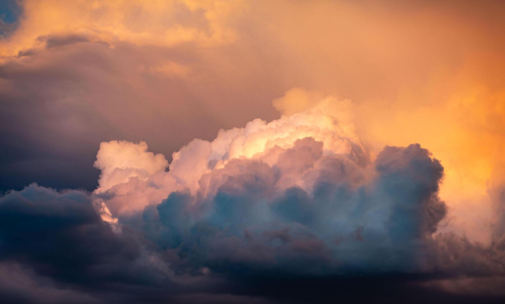 Multicolored sky with clouds and dramatic lighting orange collor photo