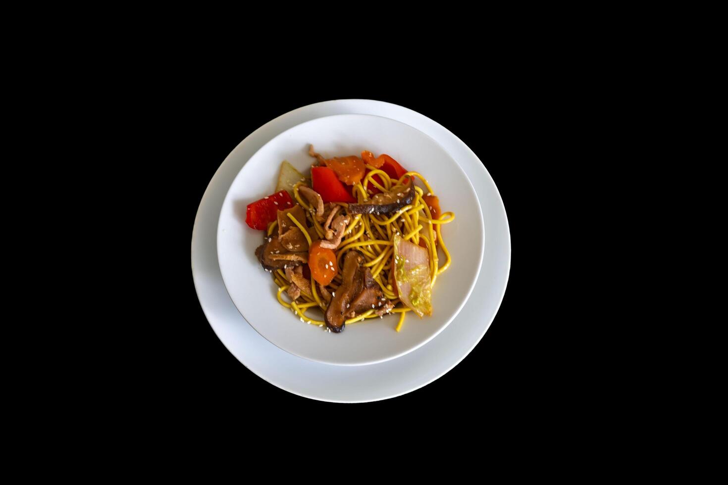 The most traditional yakissoba prepared with vegetables, noodles, pork and oriental spices. isolated photo