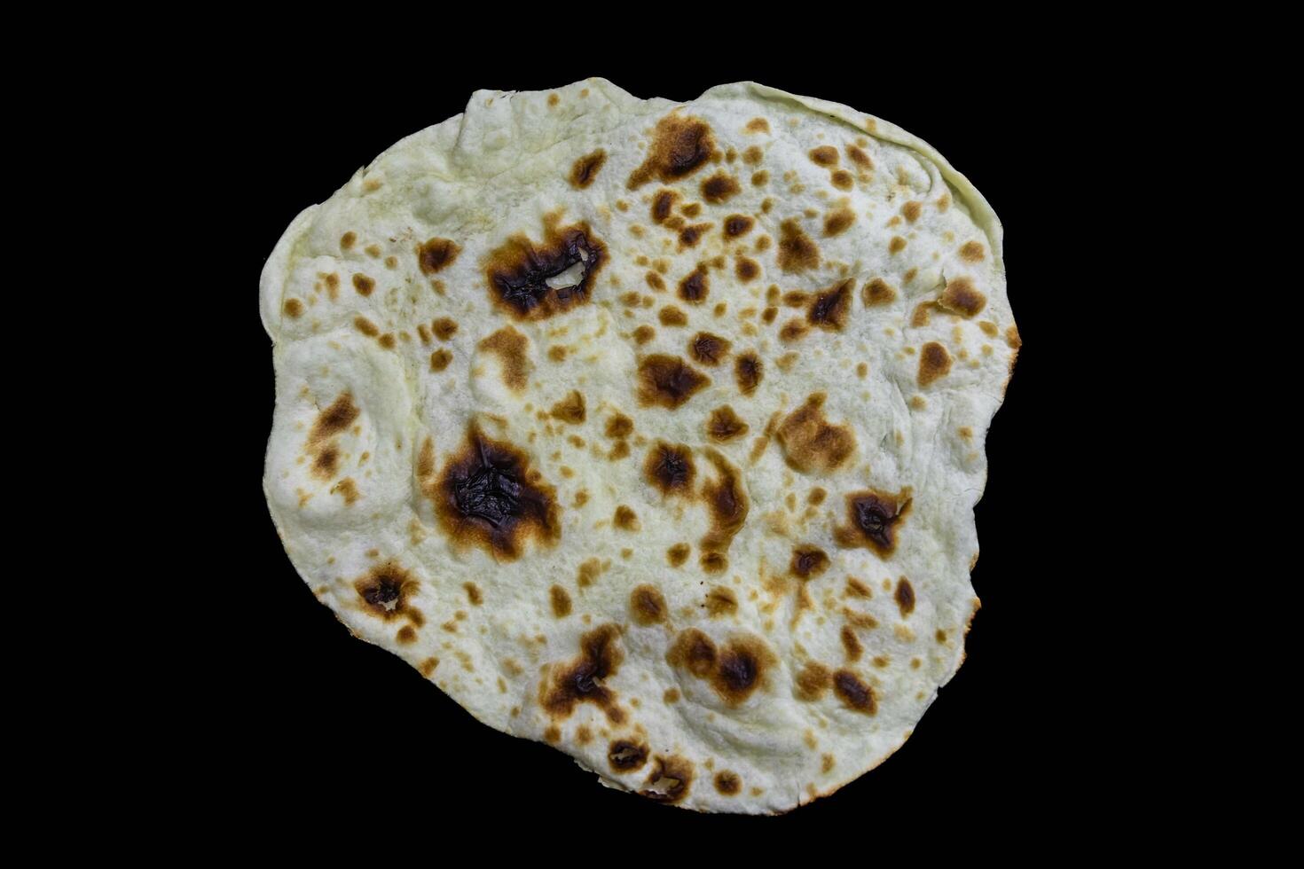The most traditional and classic shawarma prepared in Syrian bread or pita bread grilled on a stone isolated photo