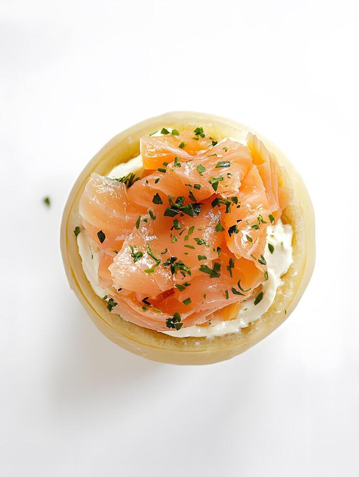 A small dish with food on top of a white table photo