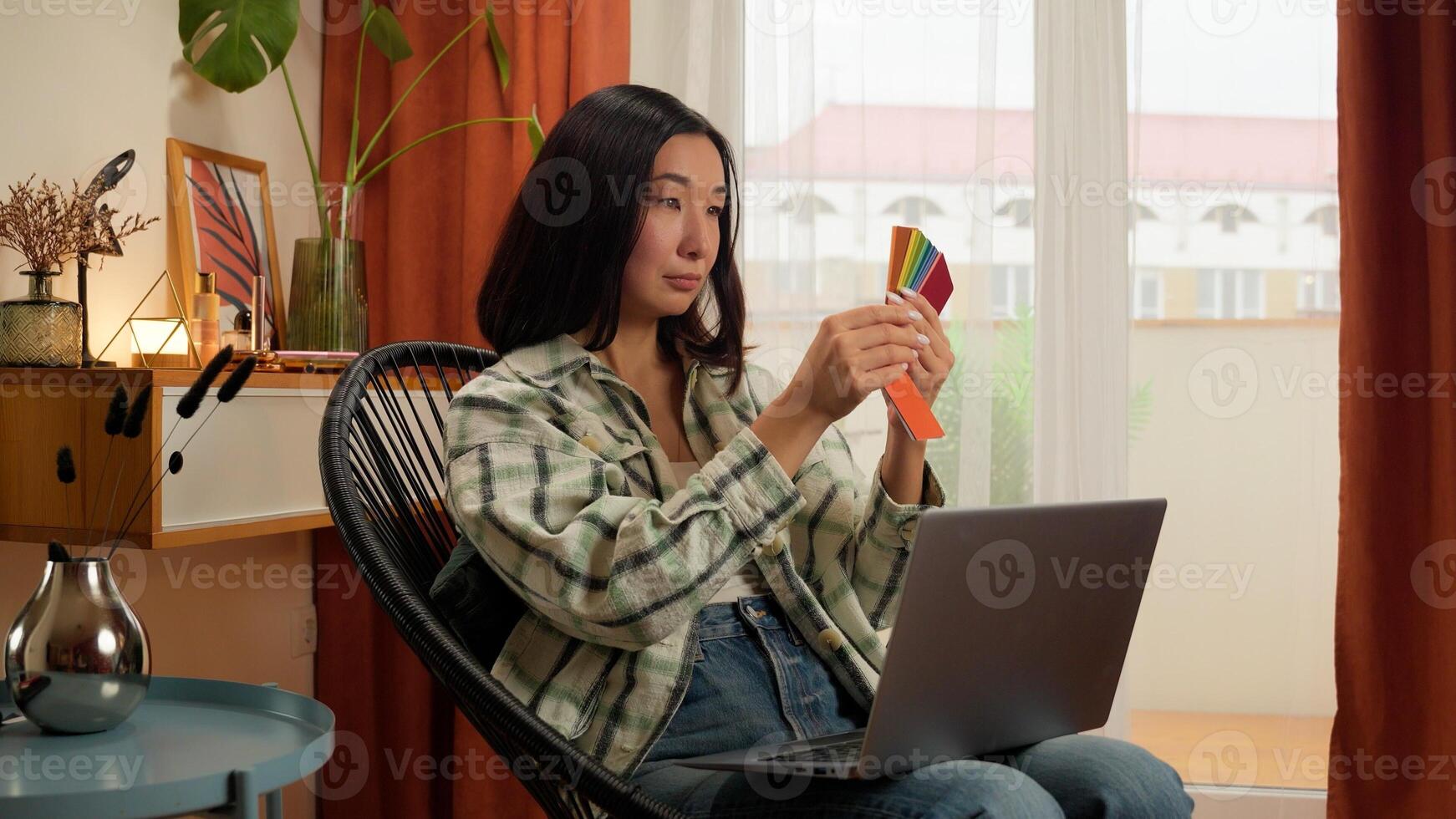 Asian Korean Chinese Japanese woman work laptop holding colors design choosing female lady householder homeowner indoor house renovation samples designer choose color tone interior home order online photo