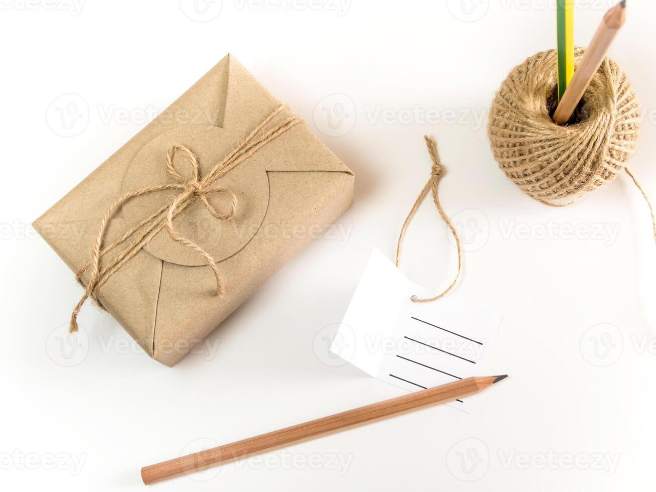 The Gift box wrapped in kraft paper and rustic hemp as natural rustic style photo