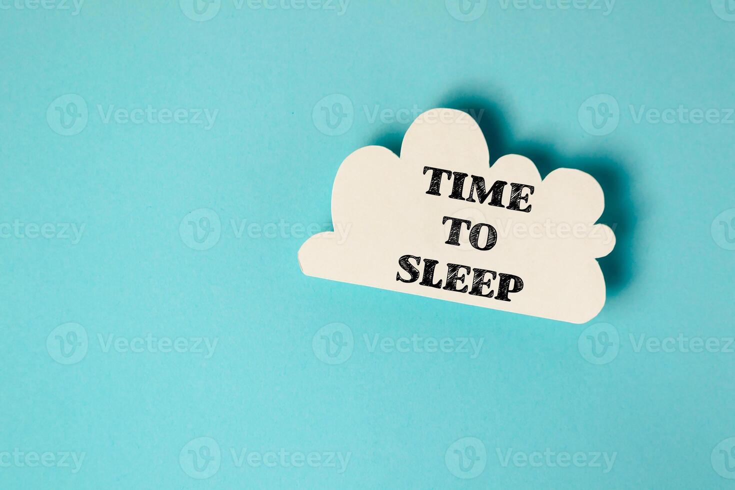A white cloud with the words time to sleep written on it photo