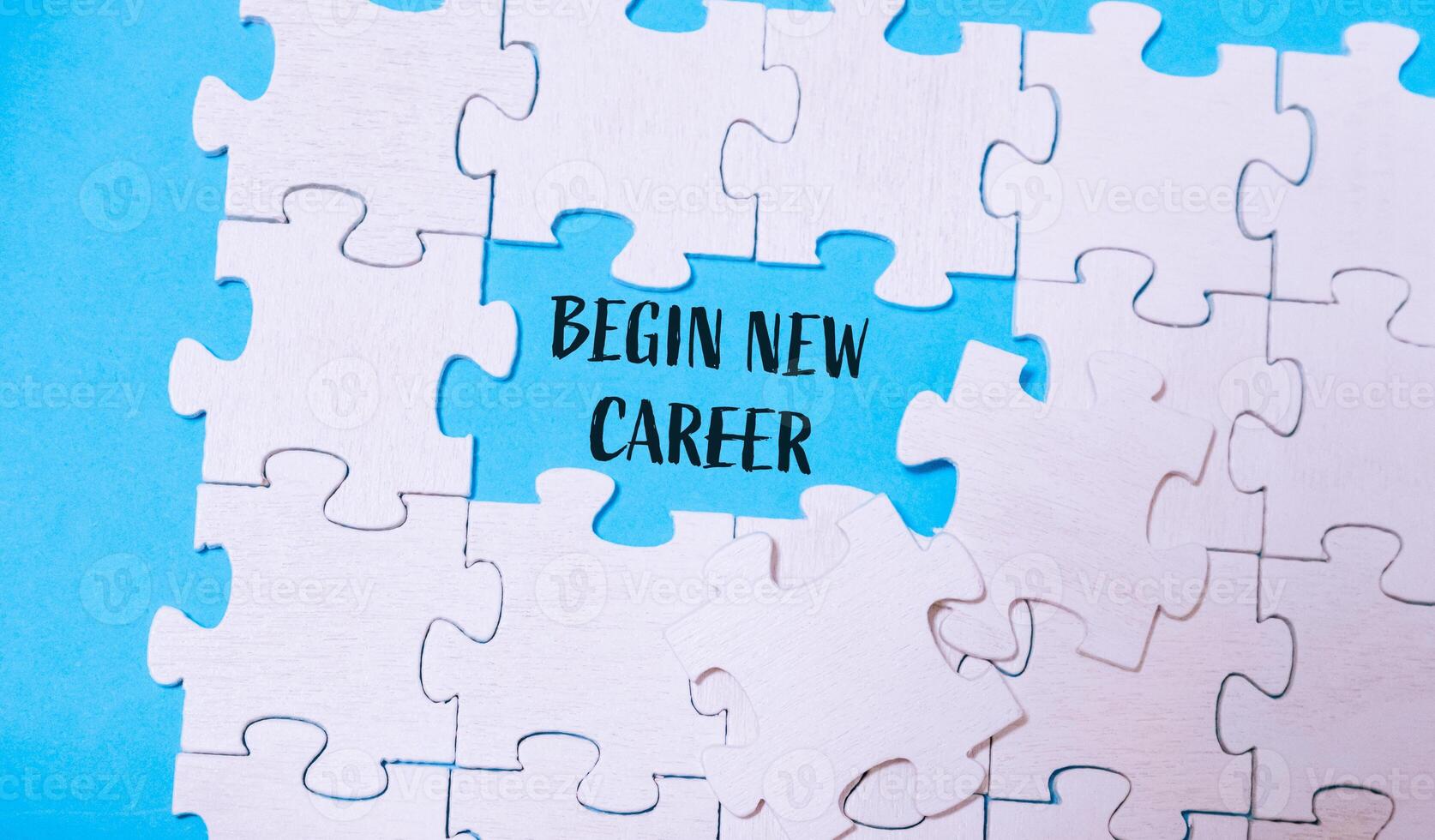 A puzzle with a word that says begin new career written in the middle photo