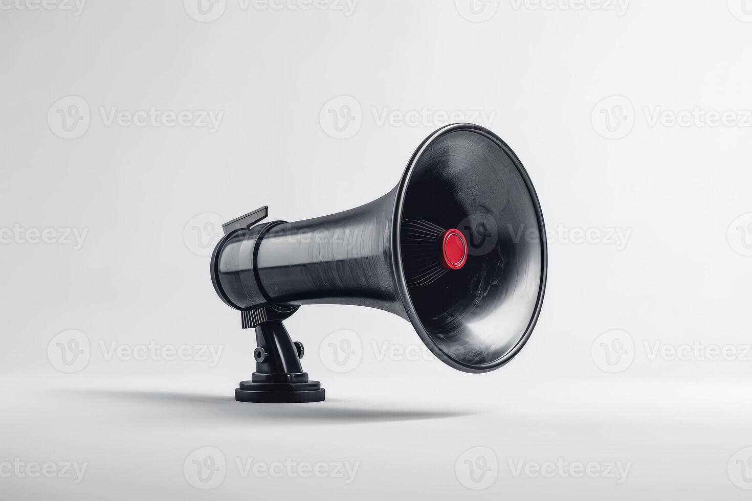 Black microphone with a cord hanging from it. photo