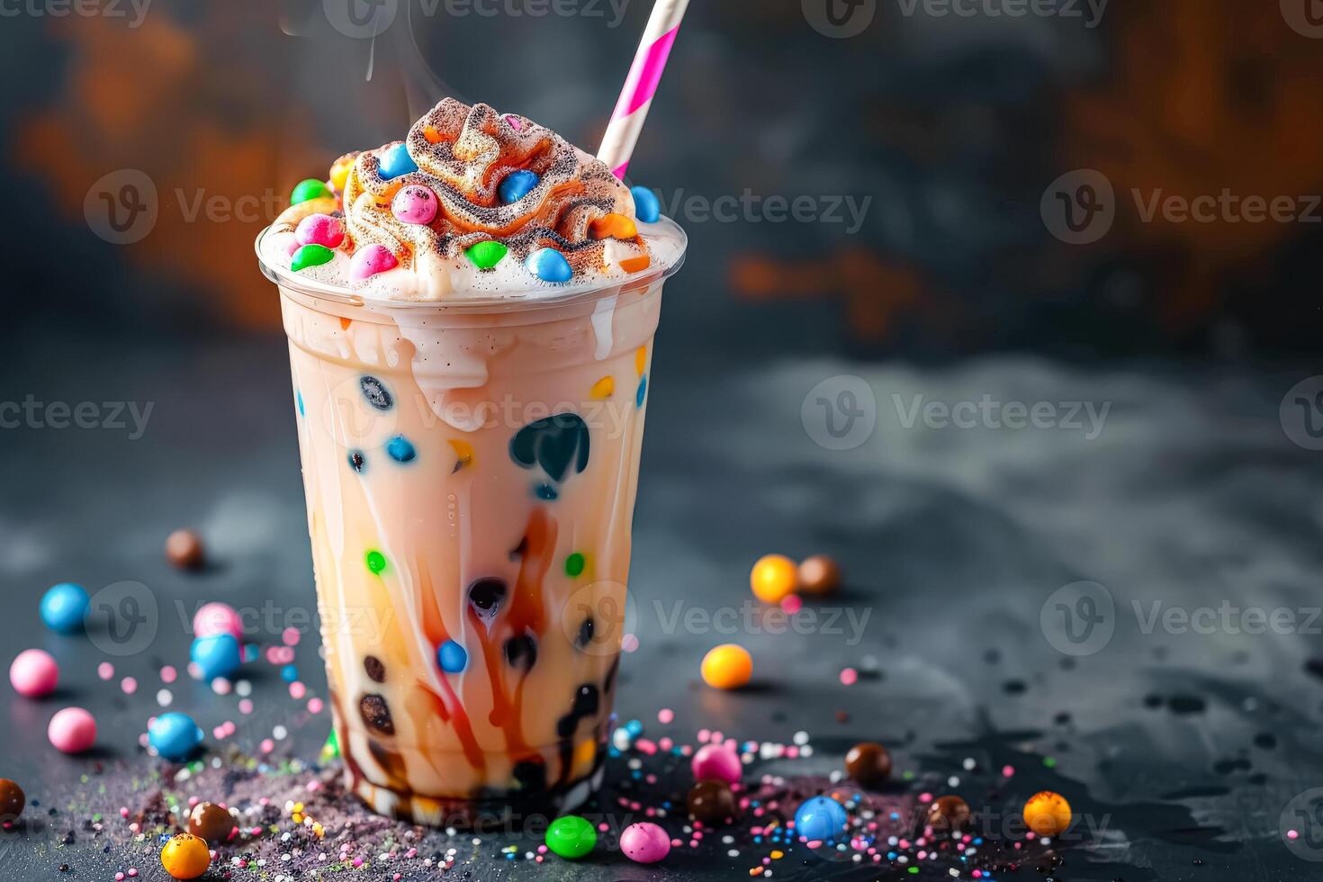 Boba tea with whipped cream and colorful toppings in a glass jar photo