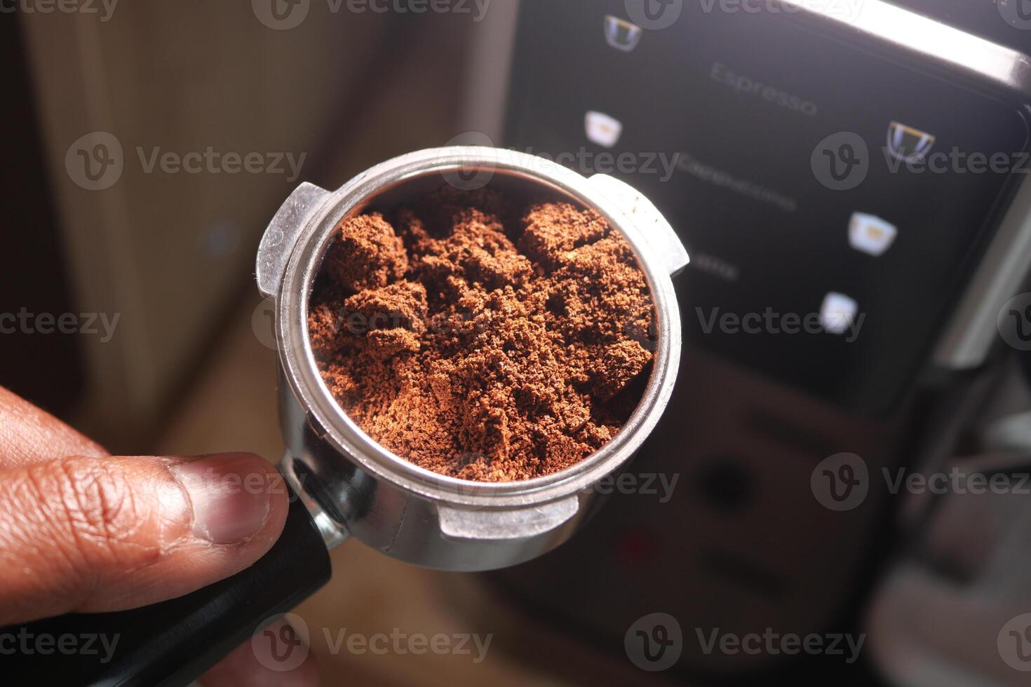 Preparing freshly ground coffee for brewing at home photo
