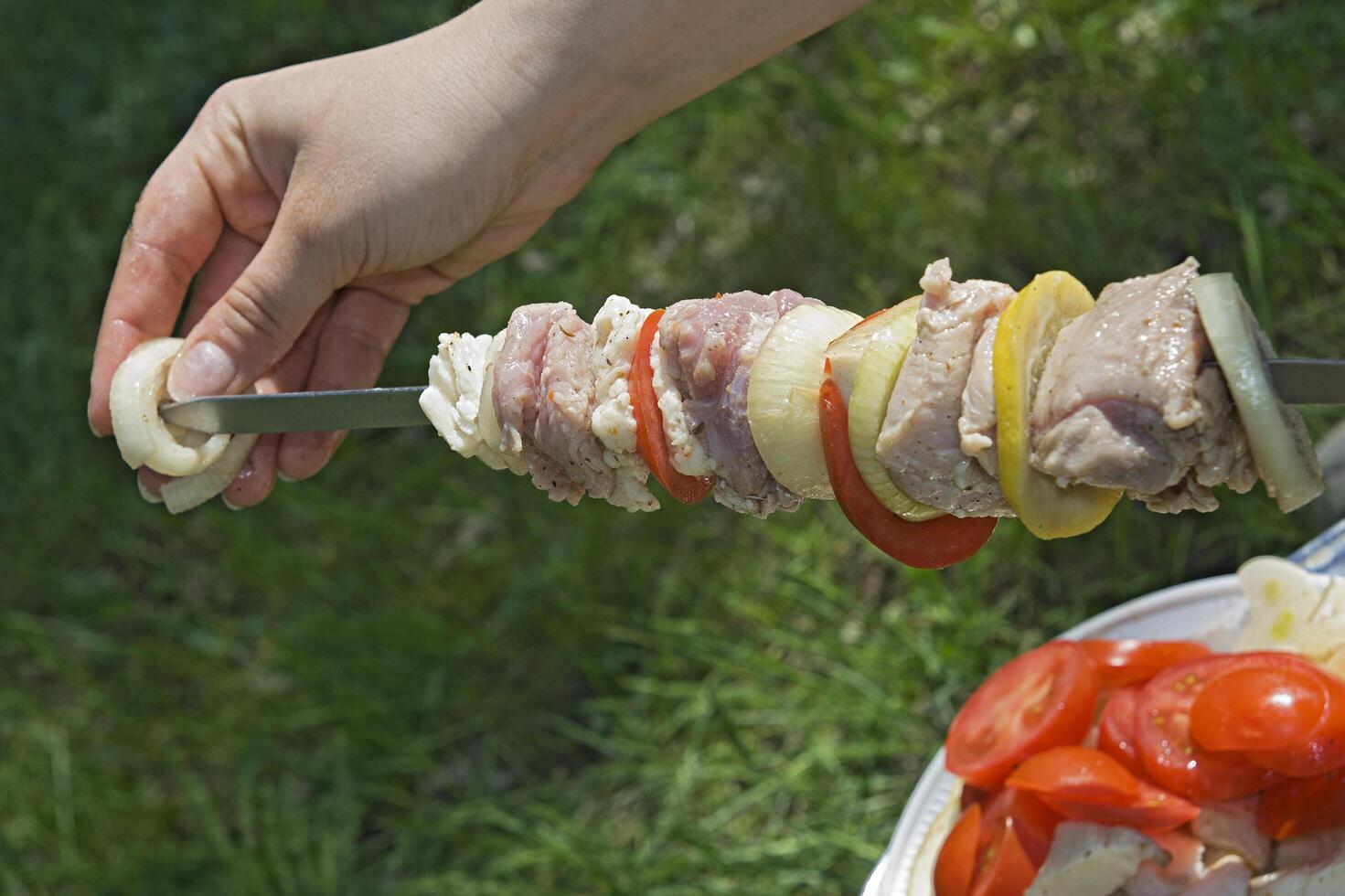 Making barbeque outdoors photo