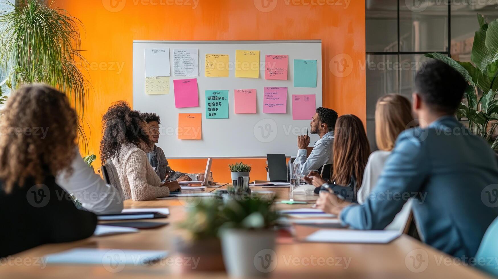 Diverse group brainstorming in modern office photo
