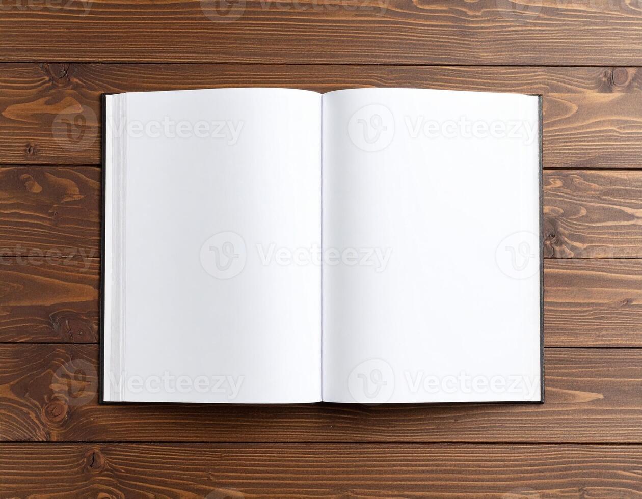 Open Hardcover Book with Slightly Turned Pages on Wooden Surface photo
