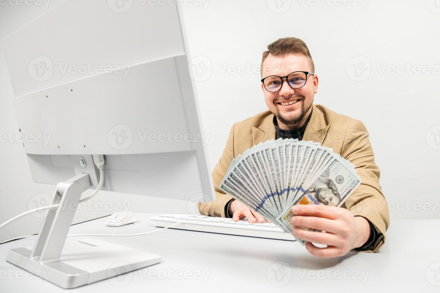 Businessman holding a large sum of cash against a bright background in a stylish office. Concept success, financial confidence, and achieving business goals in a modern office photo